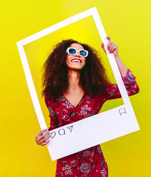 A cheerful woman posing with an Instagram-style frame, showcasing Uzmate's social media marketing solutions for personal and business branding.